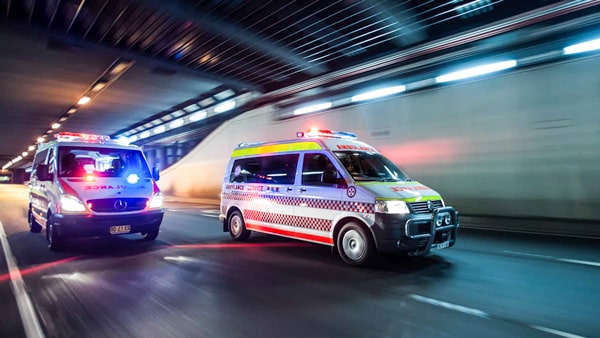 When you hear the sirens or see the red emergency lights of a closely approaching emergency vehicle, you must: