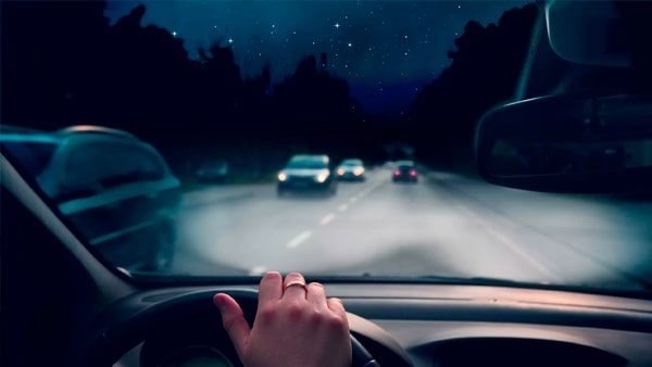When approaching another vehicle from the rear at night, you must dim your bright headlights within: