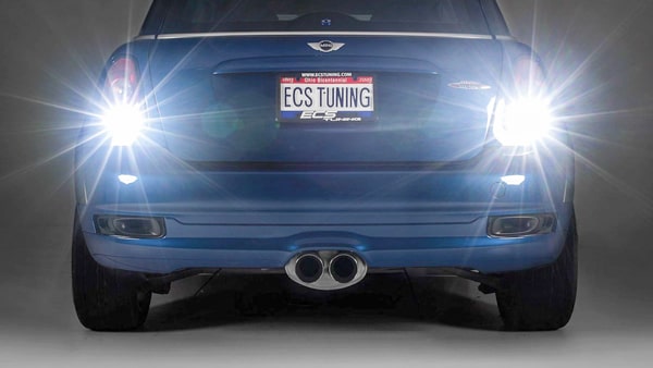When backing up your car, you should: