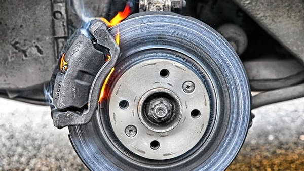 If you experience brake failure while driving, you should: