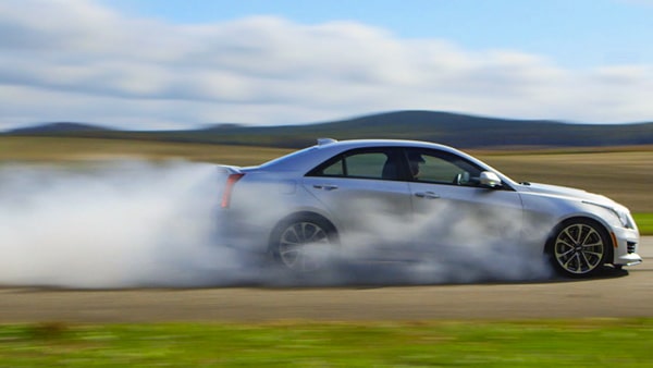 What should you do if you have to stop your vehicle in an emergency?