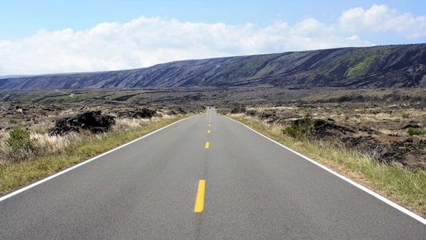 A broken yellow center line on the roadway means: