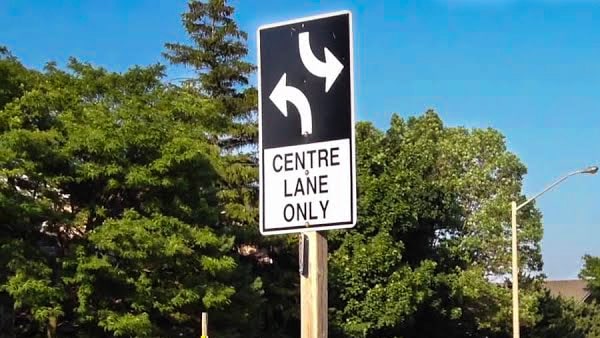 From the center lane, what maneuvers can you perform?