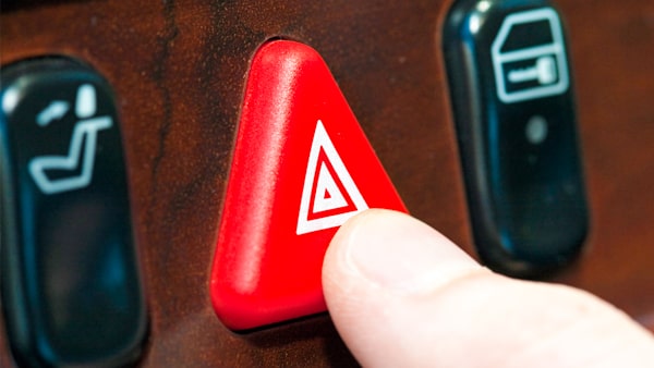 You should always use your emergency flashers when: