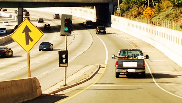 When entering a freeway entrance that allows you to accelerate to merge, you should drive at: