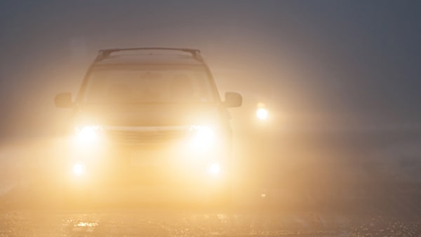 When should you use your headlights while driving?