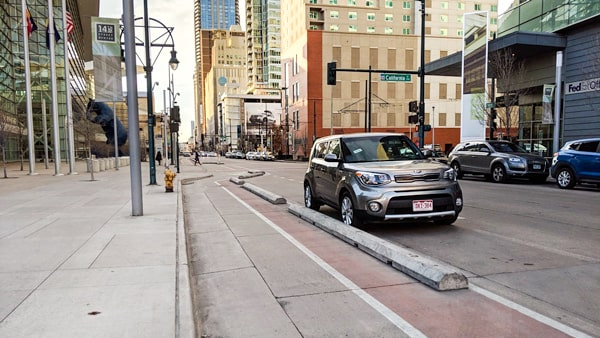 When you park on a level road next to a curb: