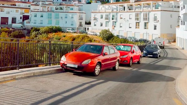 When parking your vehicle facing uphill with a curb, you should point your front wheels: