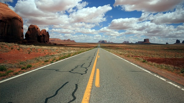When the road is marked with a solid yellow line and a broken yellow line on your side you may pass: