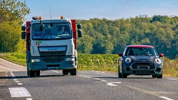 After passing a car, it is safe to return to your driving lane when: