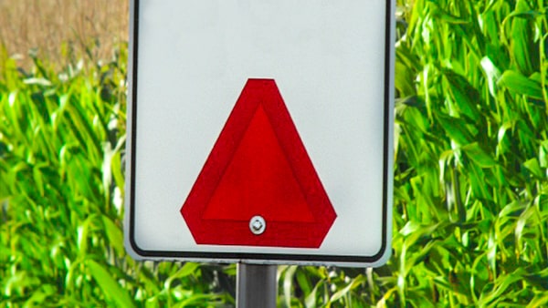 An orange and red sign of this shape always means: