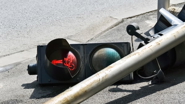 When a traffic signal light is not working, you should:
