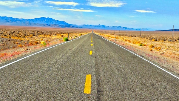On a two-way highway, you are allowed to drive on the left half of the roadway when: