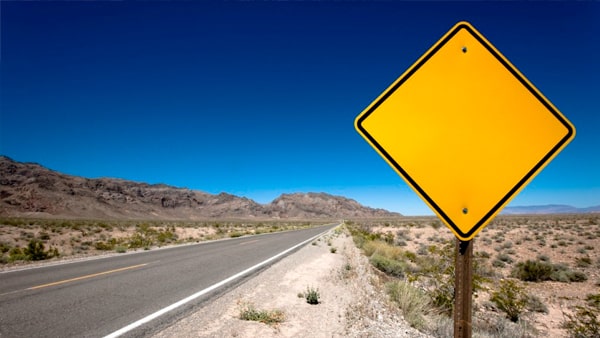 A yellow and black diamond-shaped sign: