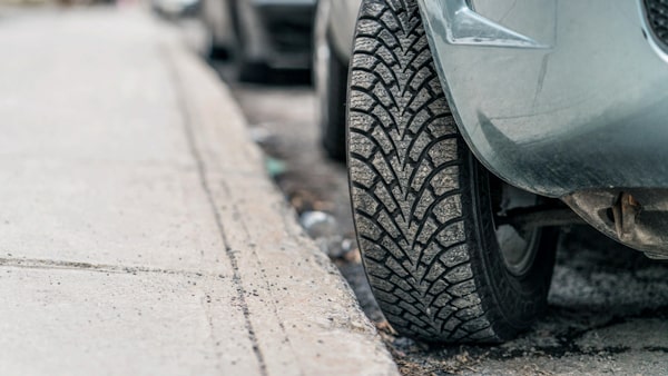 Turn your front wheels toward the curb when you are parked: